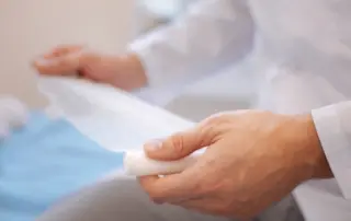 a doctor holds a bandage