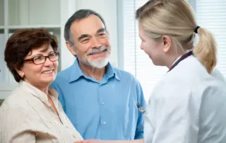 a couple at a consultation with a medical professional