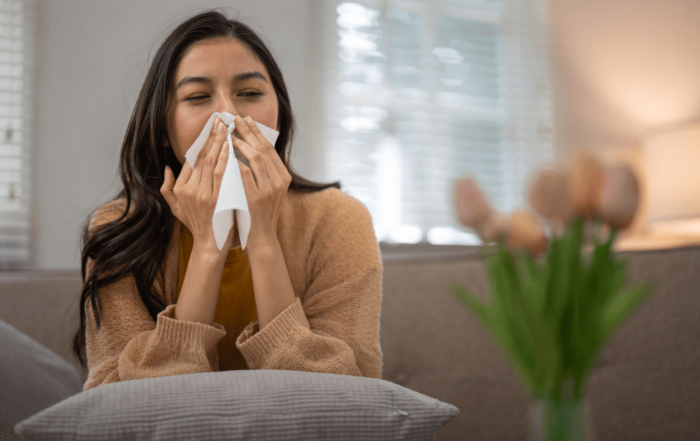 person sneezing from allergies