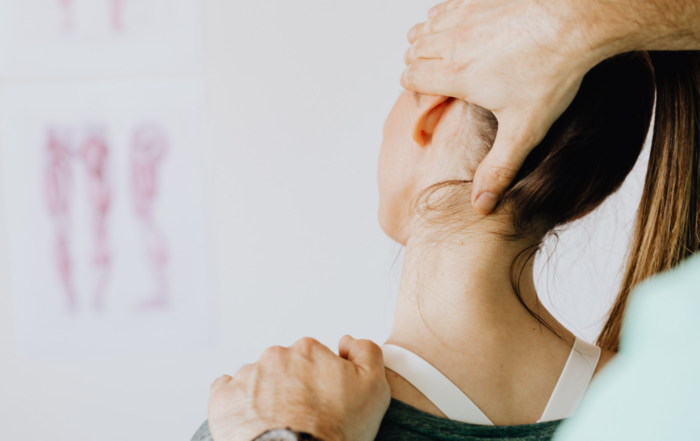 woman having neck stretched for pain