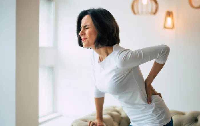 lady with pain needing Chiropractic care in Desert Ridge