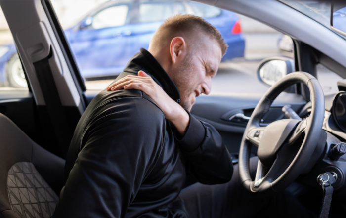 man in car after accident