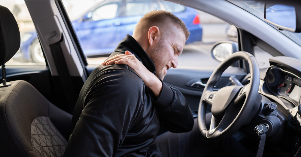 man in car after accident