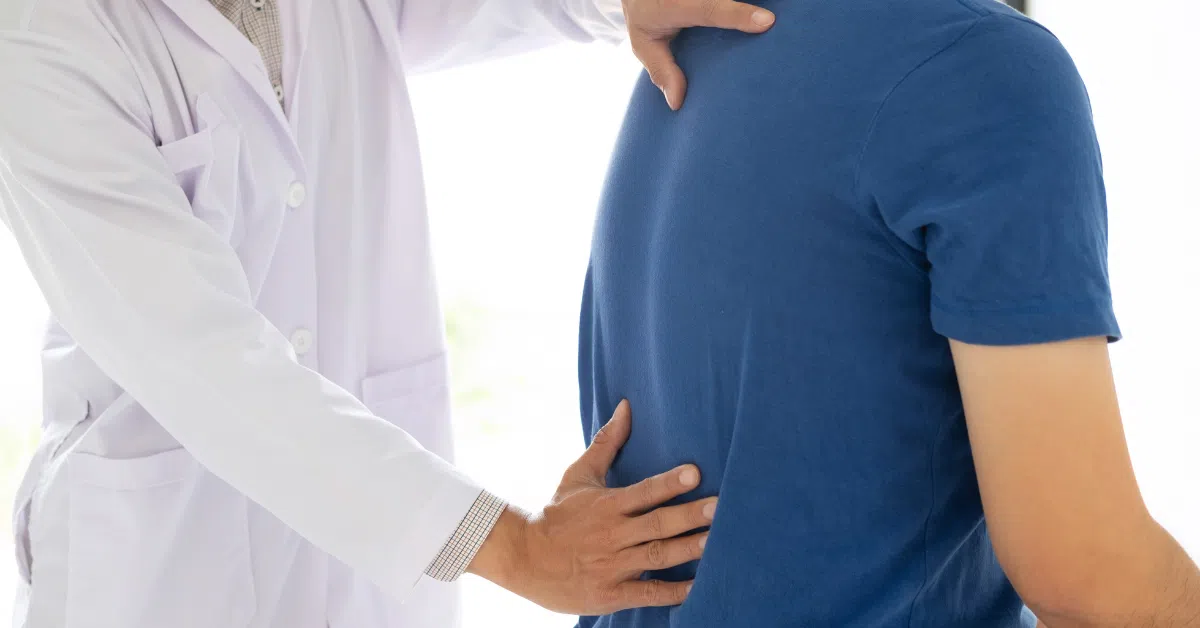 doctor examining a persons back