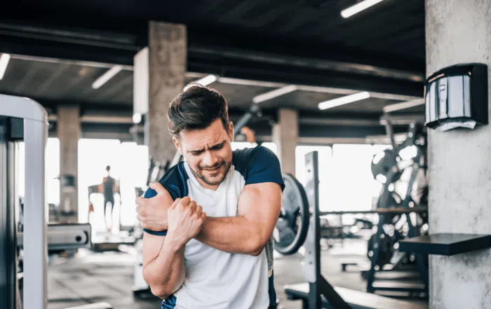 man with sports injury in gym