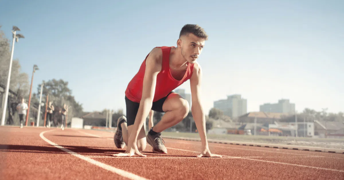 track runner at the starting line